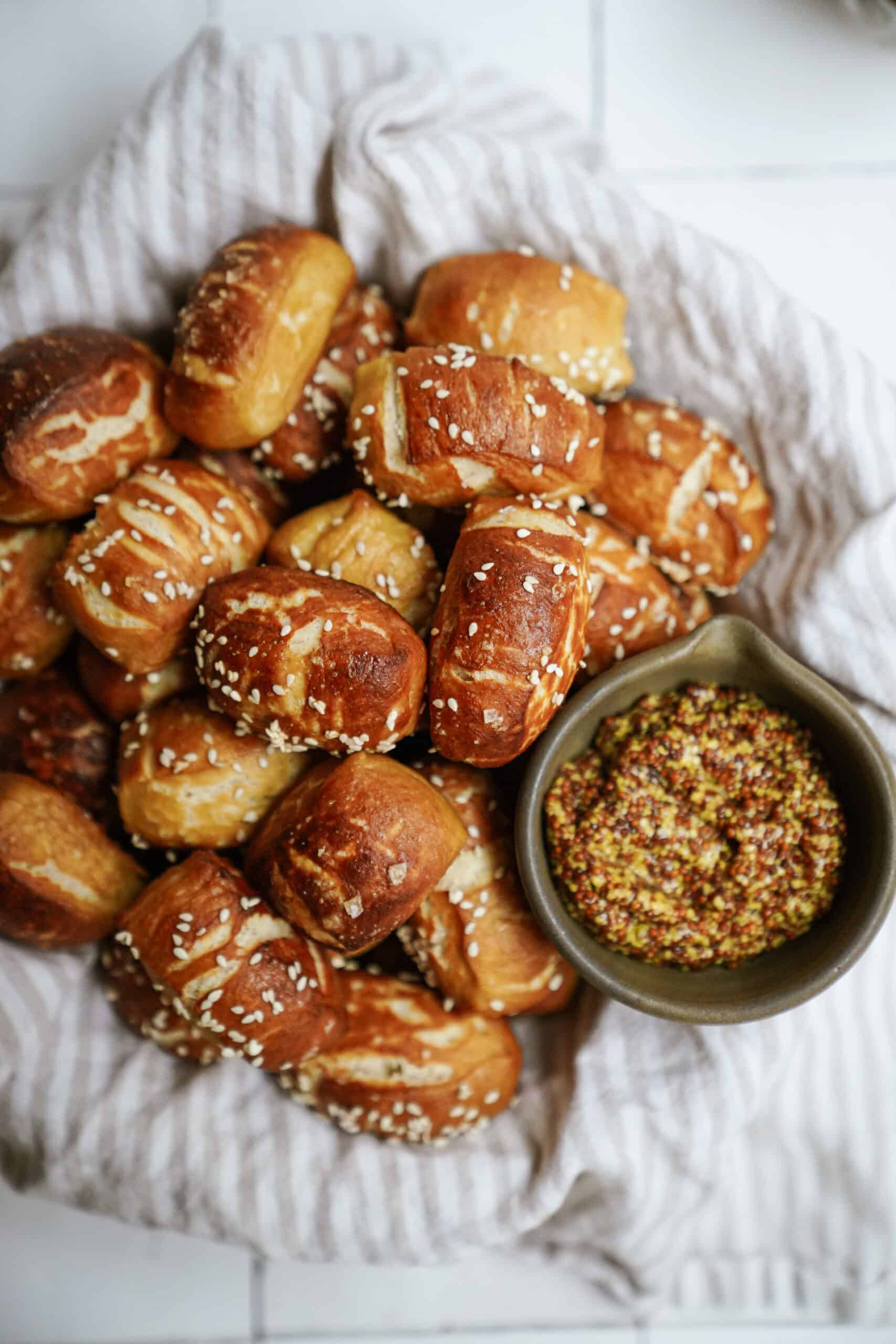 Pretzel bites in a basket next to mustard