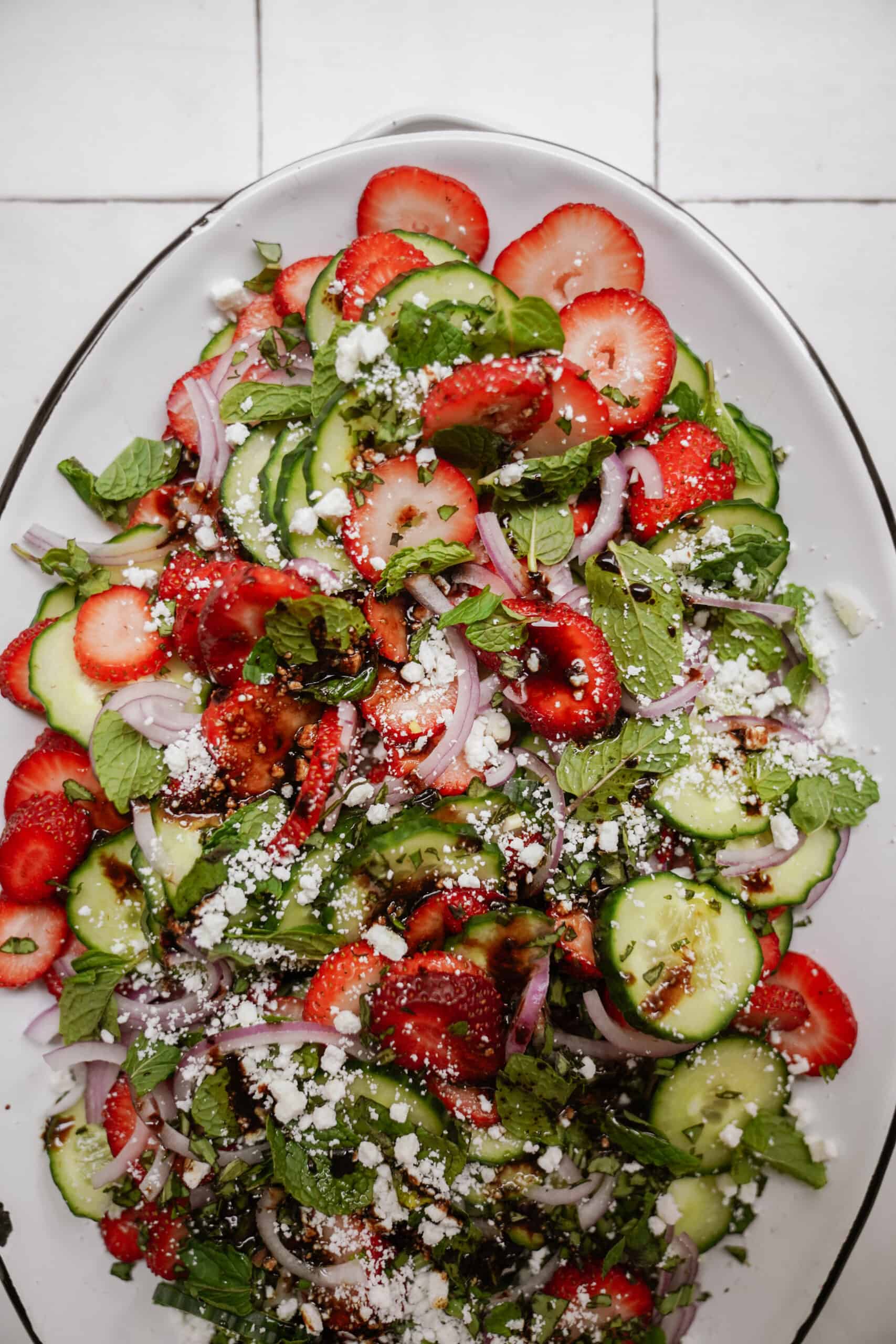 Strawberry cucumber salad on a serving plate