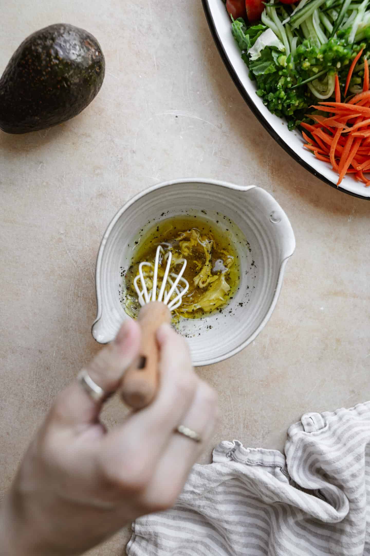 Mixing dressing for chopped salad in a small bowl