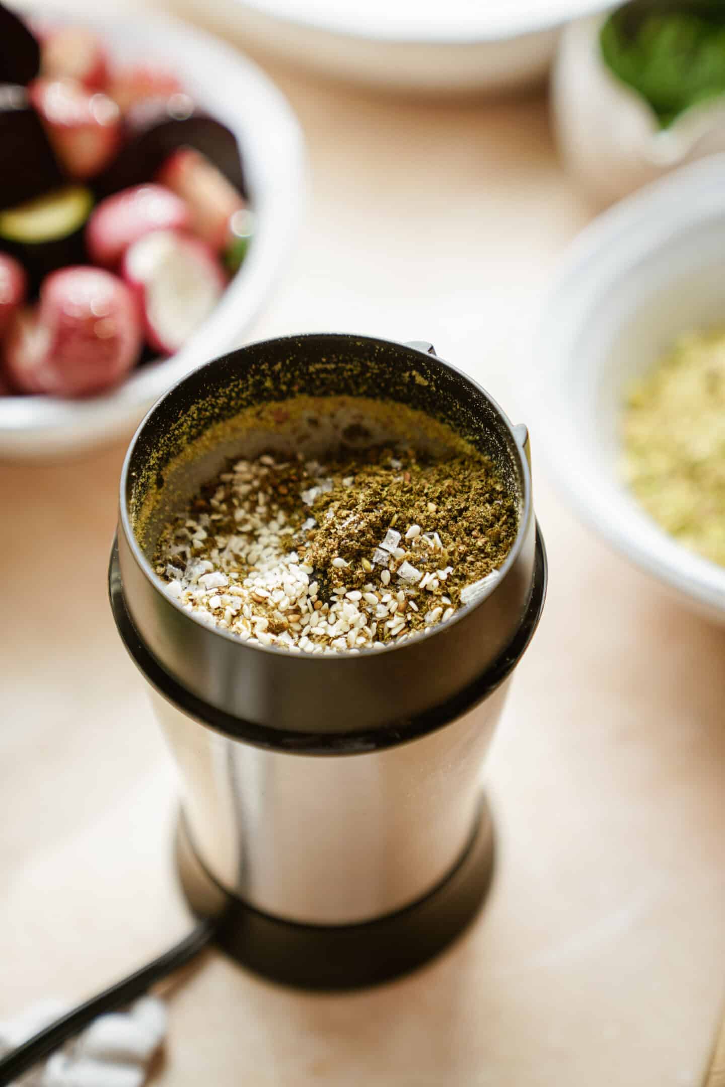 Spice grinder grinding up spices for dukkah