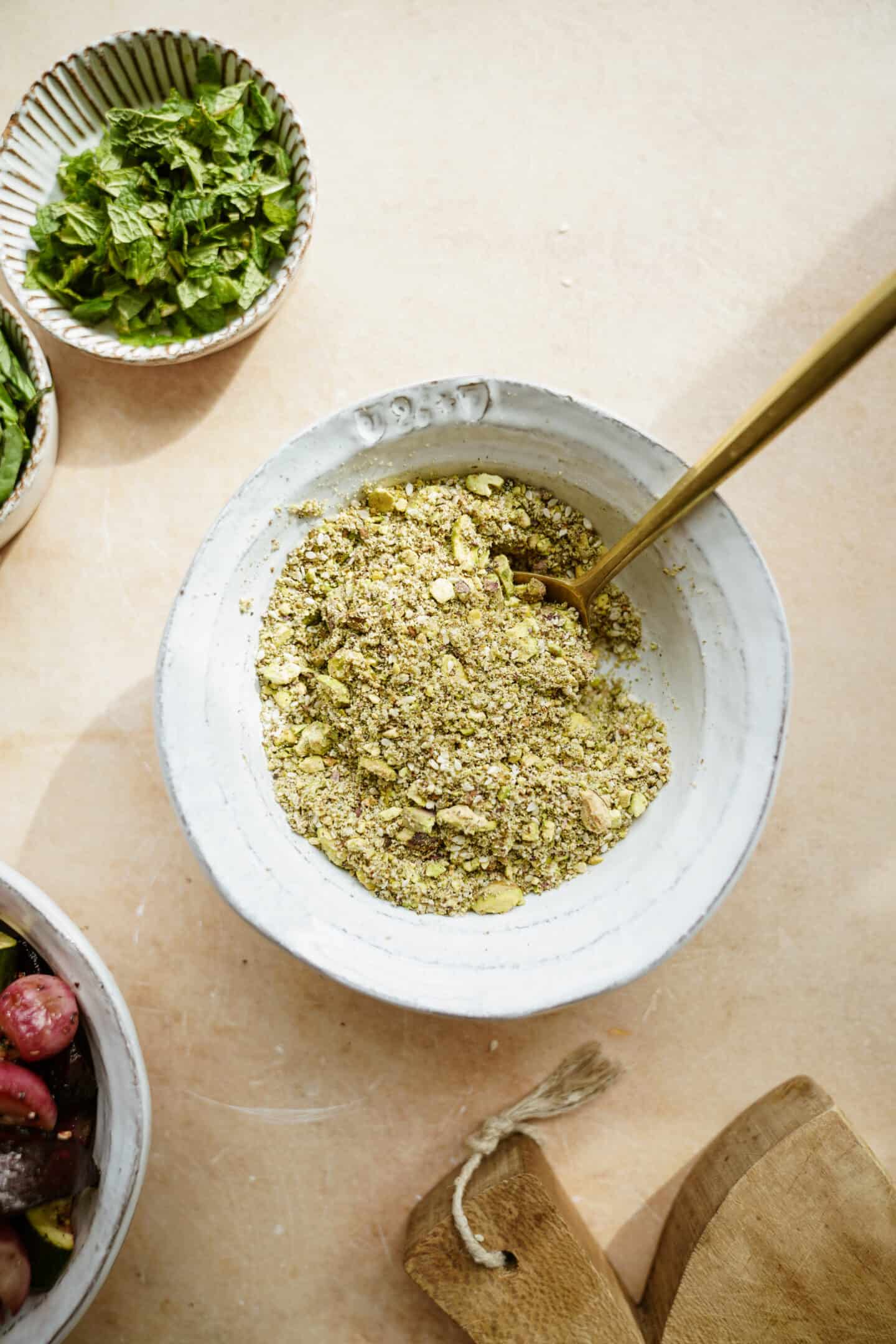 Dukkah in a bowl with a spoon