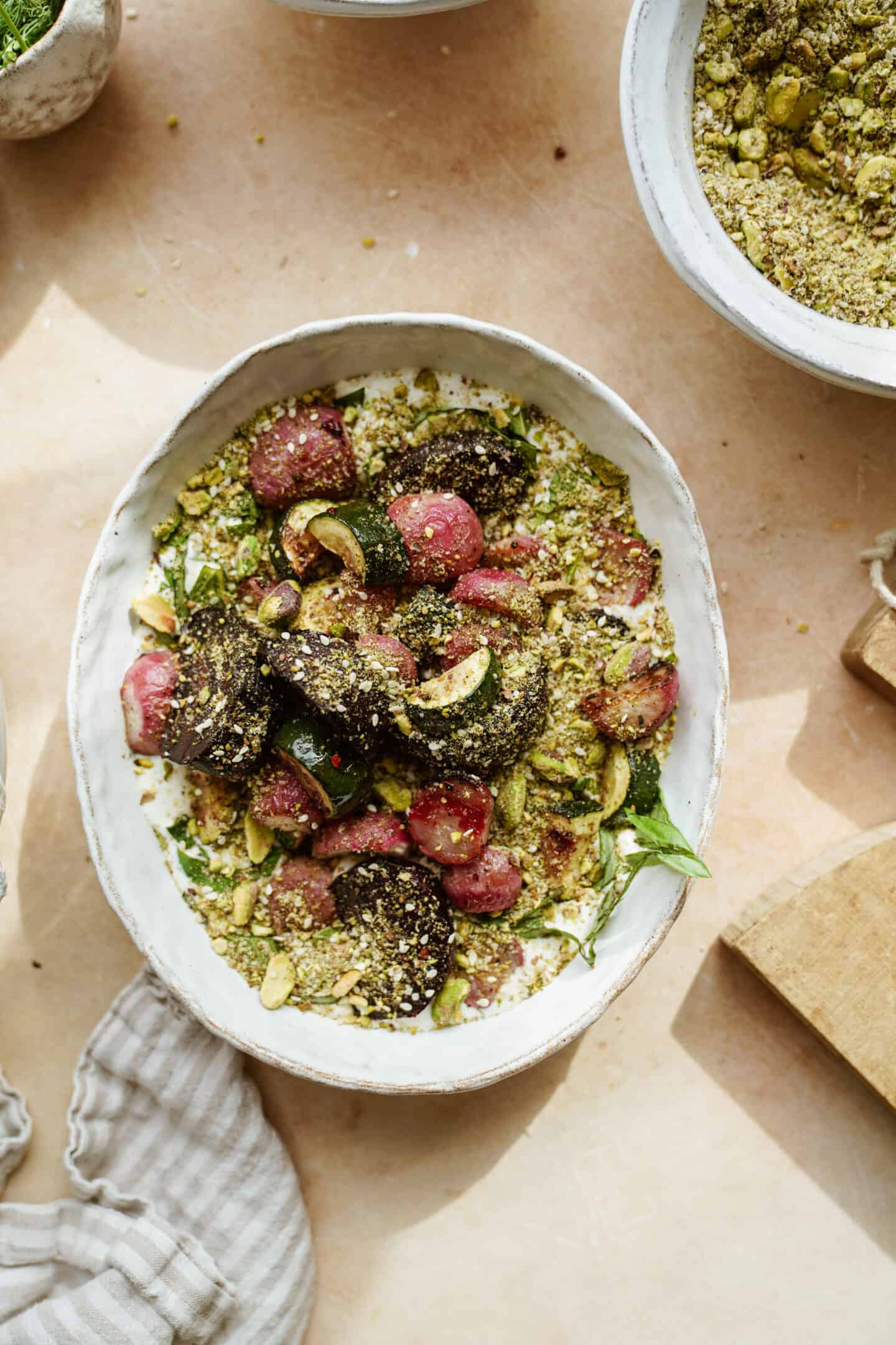 Dukkah with roasted veggies on a large serving dish