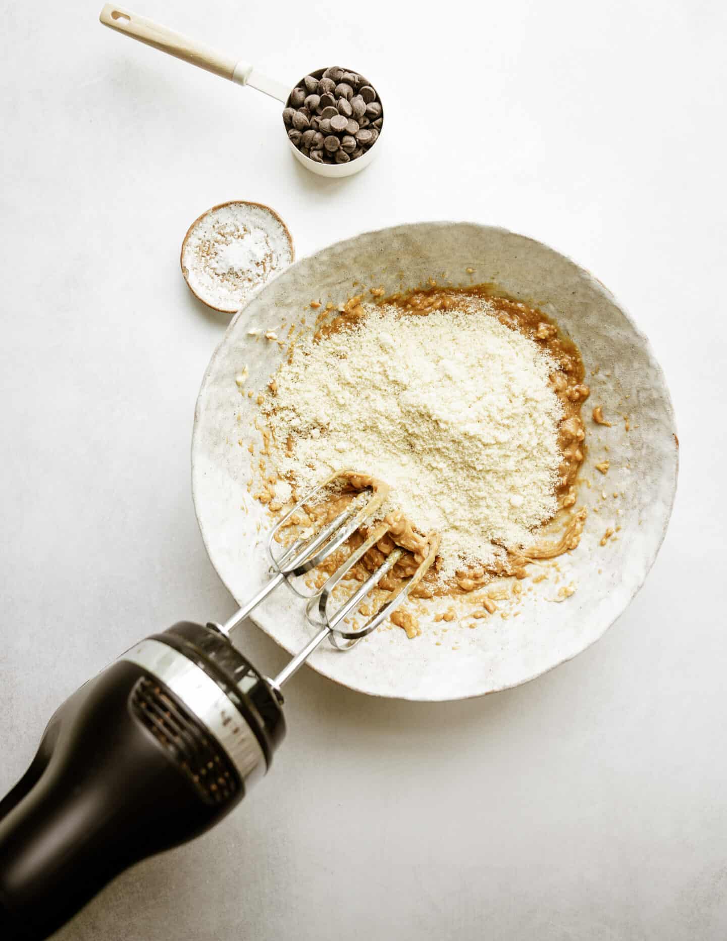 Flour being added to ingredients for edible cookie dough
