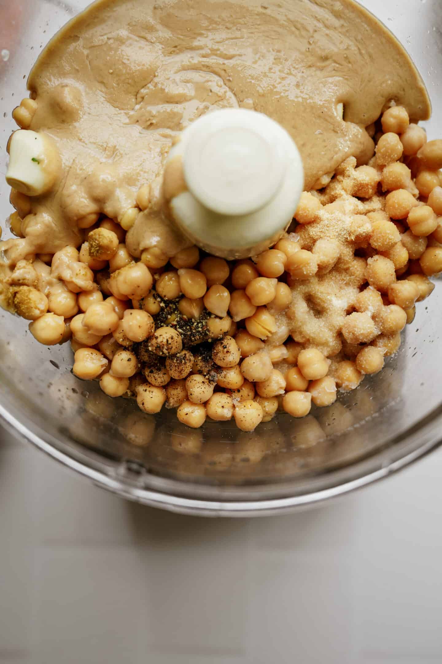Ingredients for hummus in a food processor