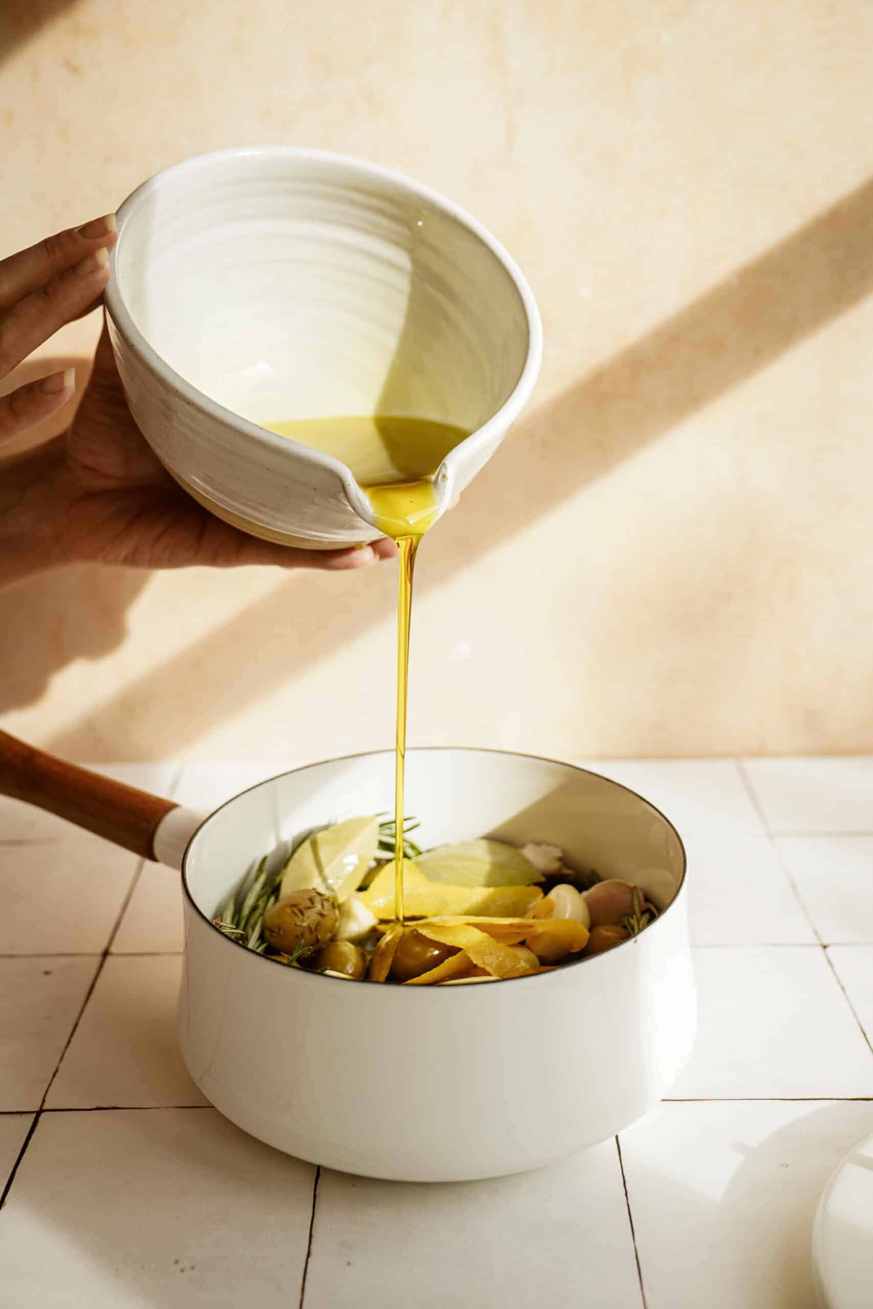 Olive oil into pot