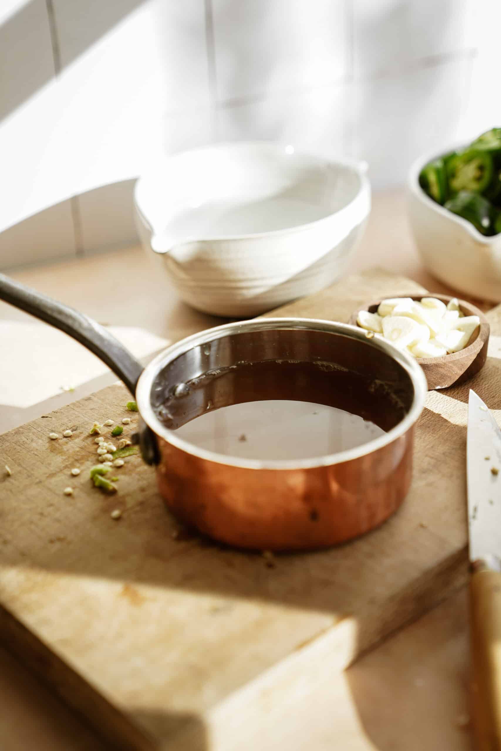 Pot with brine on a cutting board
