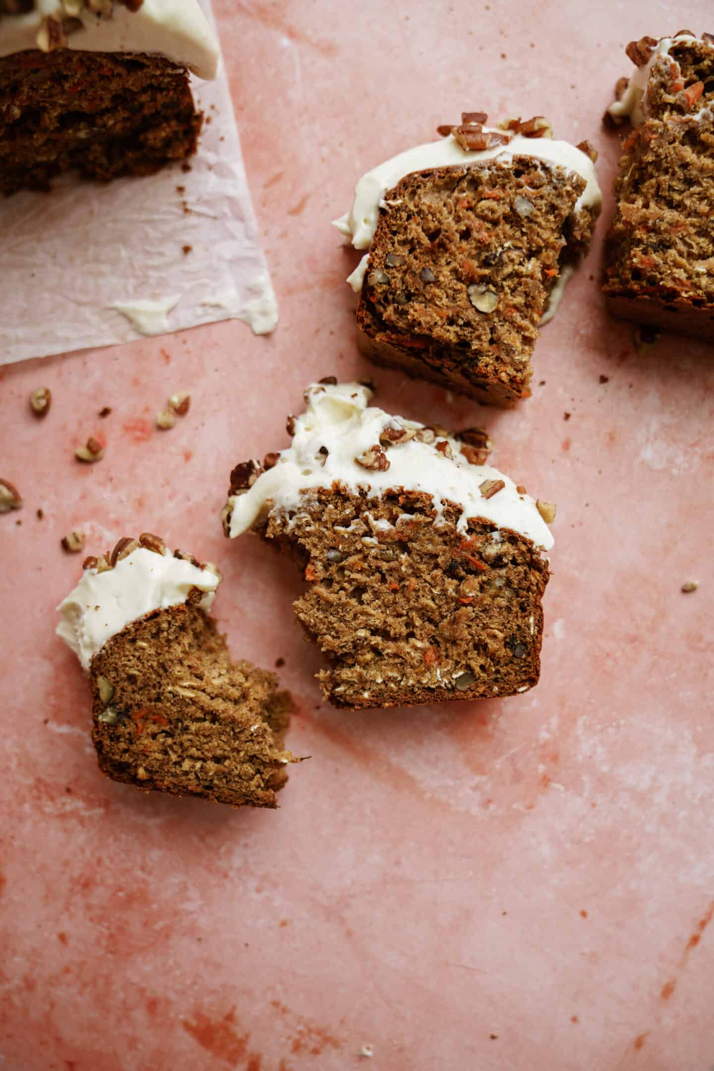 Pieces of carrot cake banana bread on counter