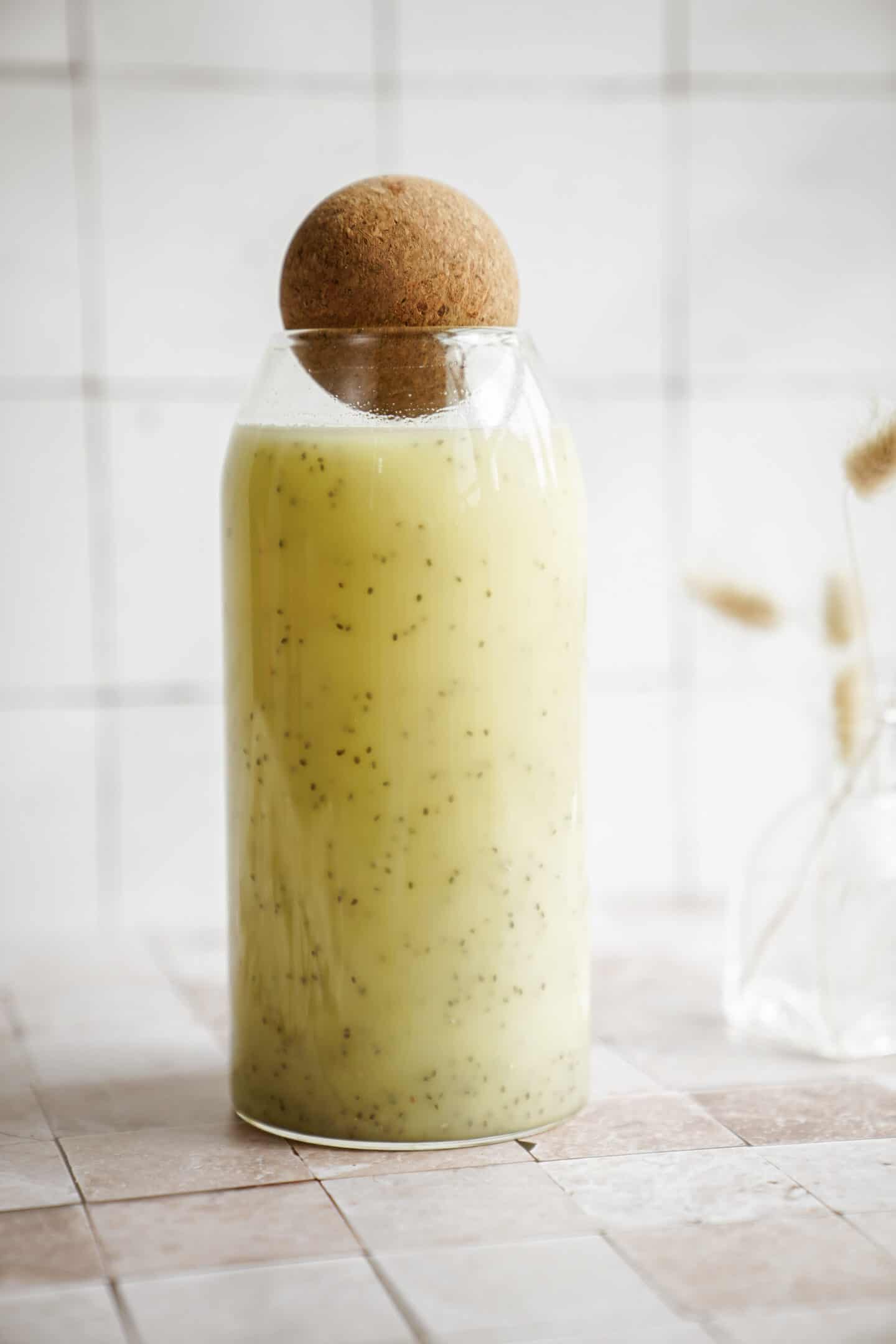 Close-up of fresh ginger juice in a bottle