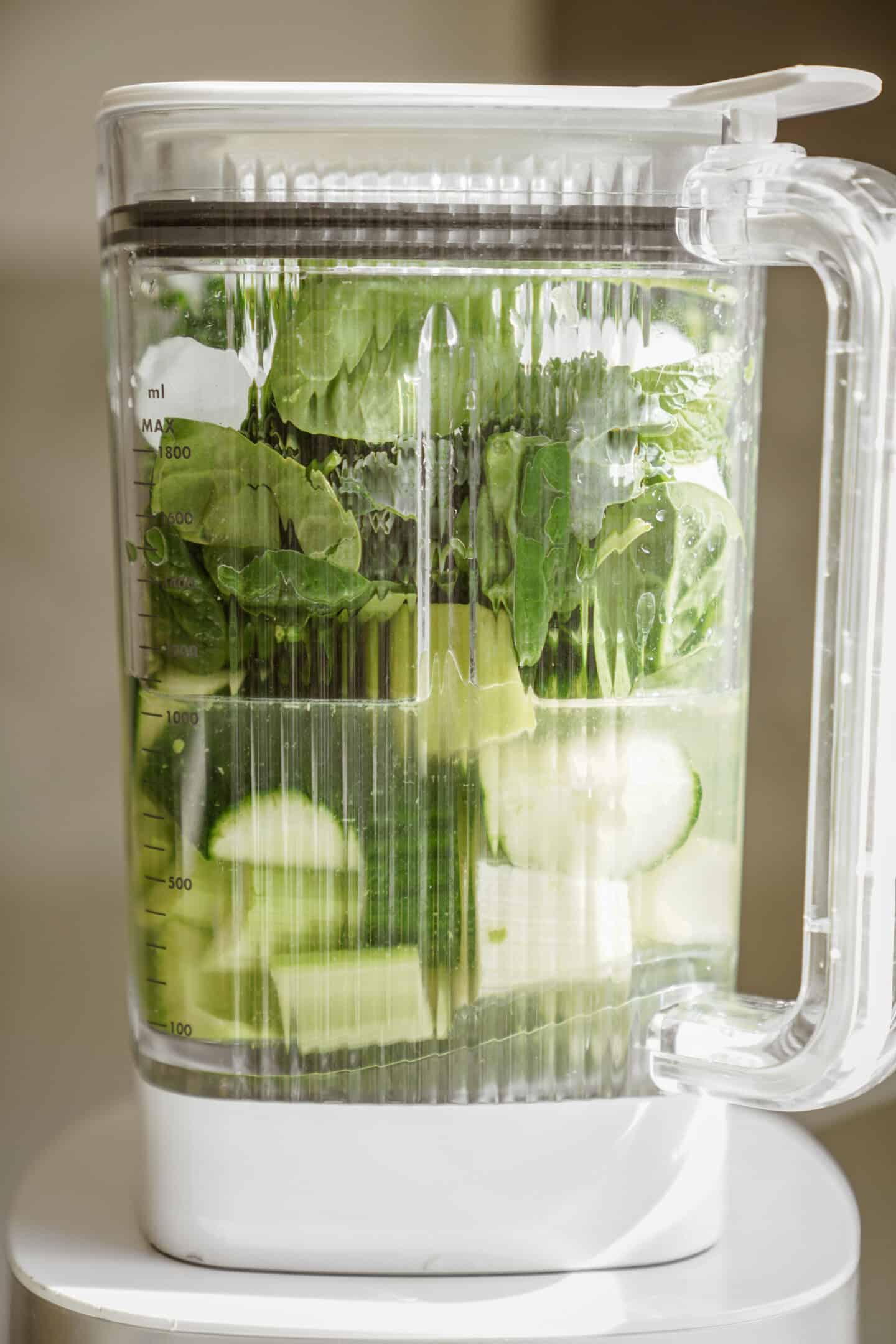 Fresh ingredients in a blender for green smoothie