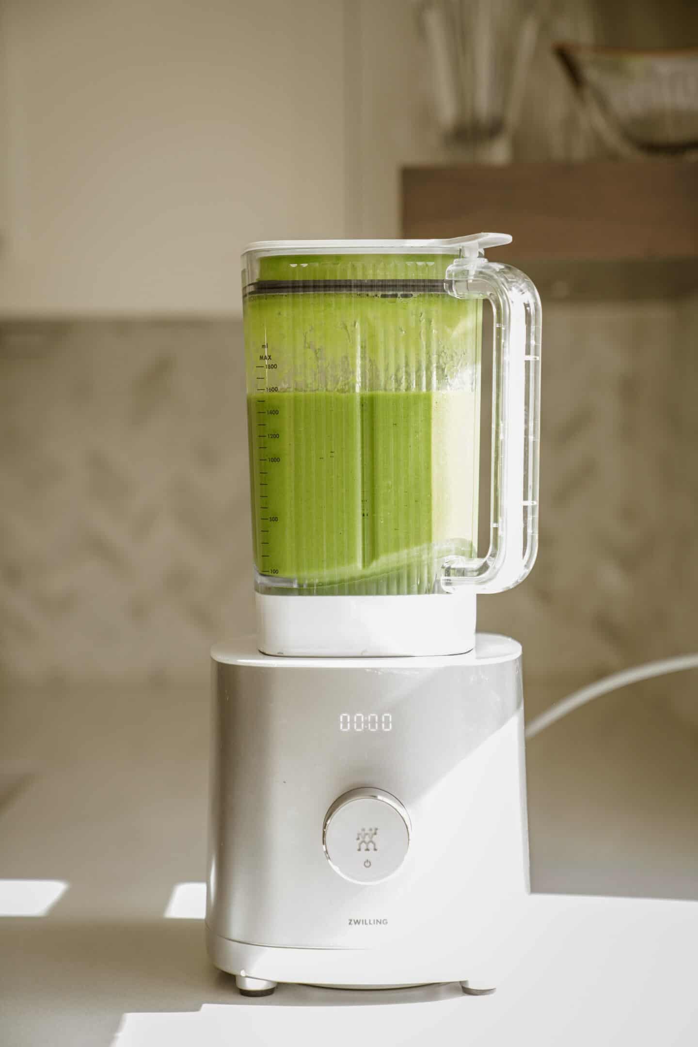 Green smoothie blended up in a blender