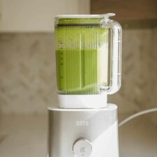 Green smoothie blended up in a blender