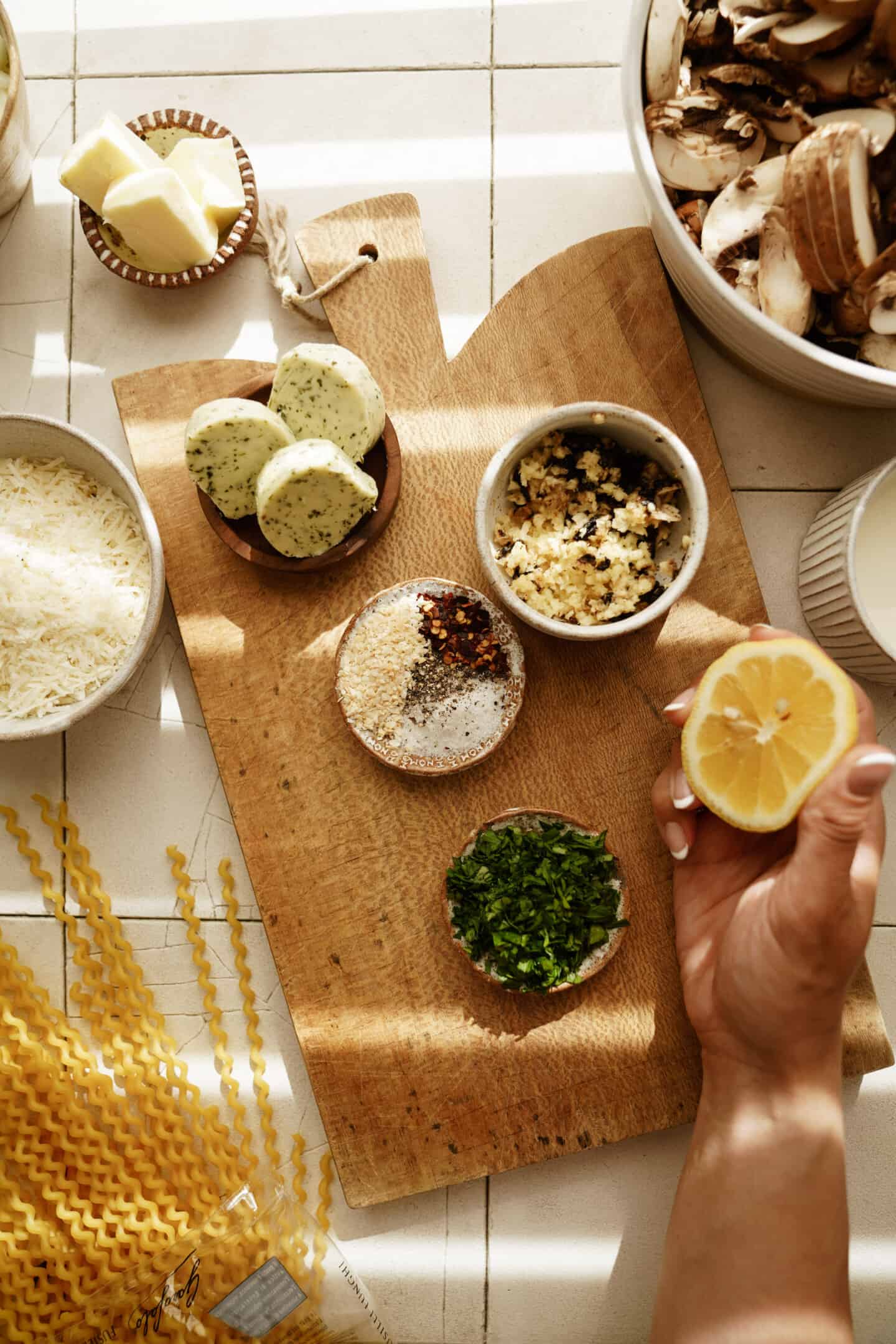 Ingredients for mushroom sauce on a cutting board