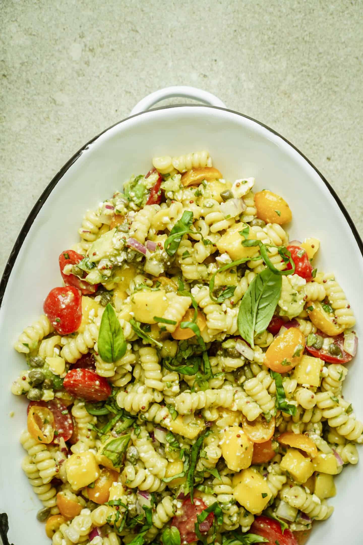 Big serving dish of summer pasta salad