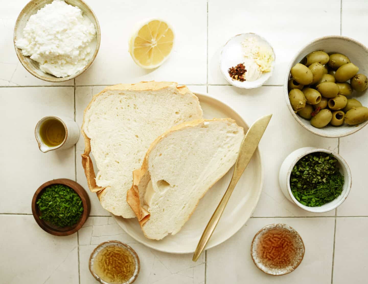 Ingredients for whipped ricotta toast on counter