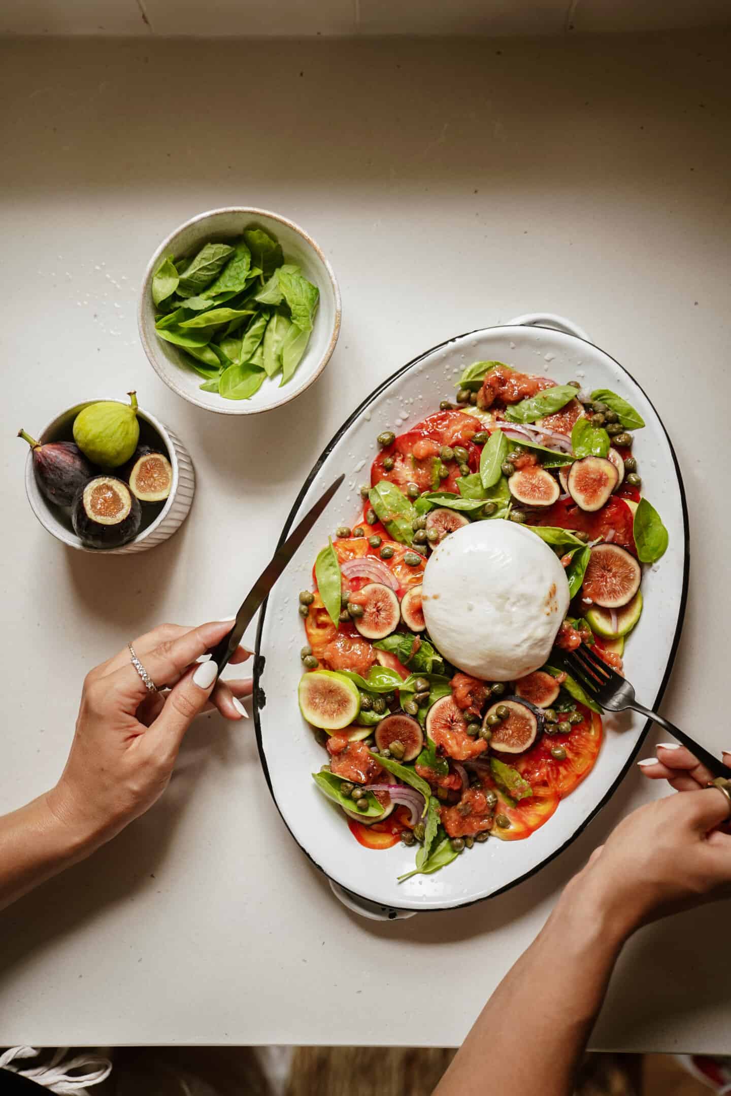 Plate with fresh burrata salad on it