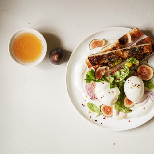 Plate of jammy eggs with a side of juice