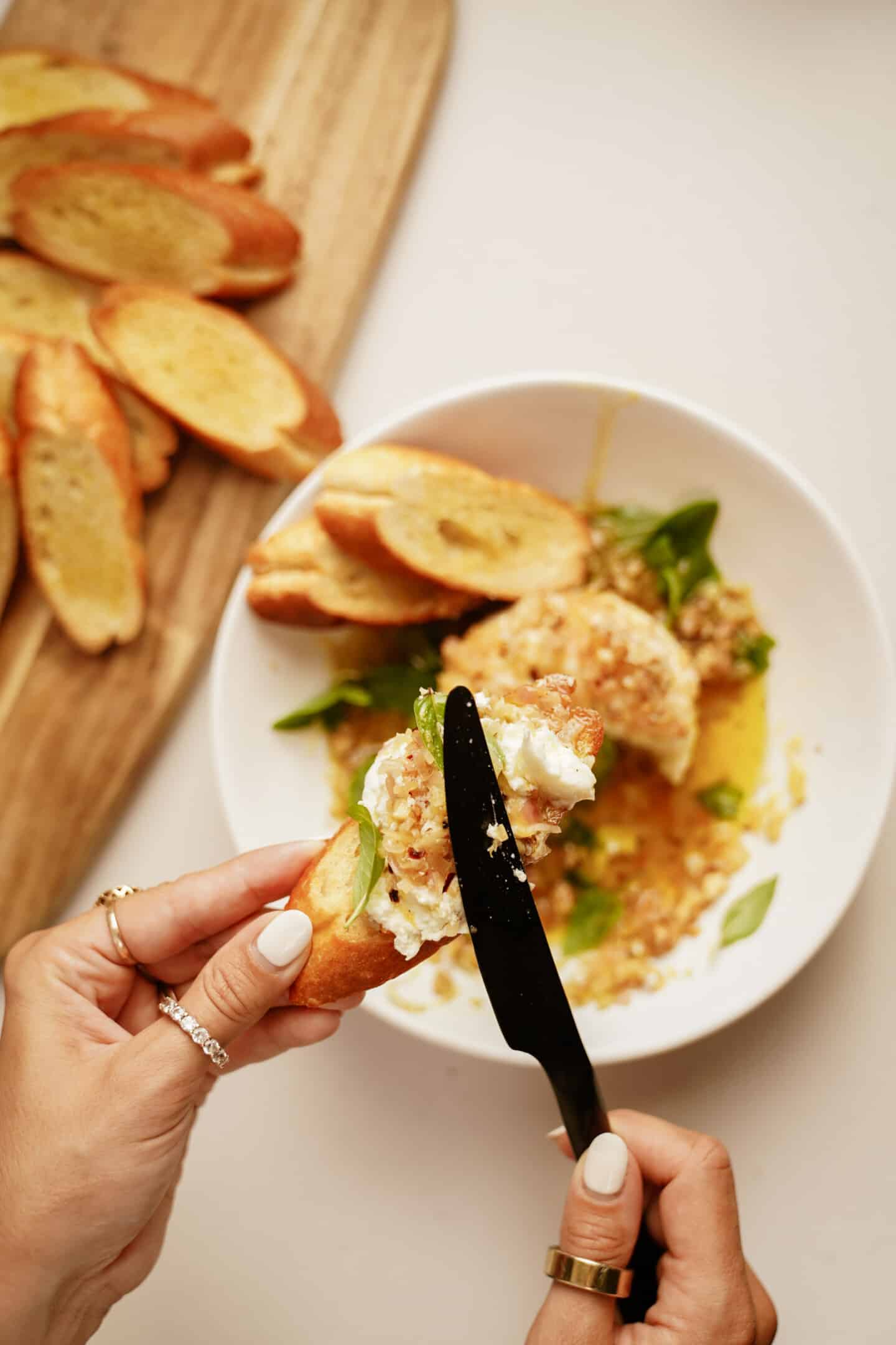 burrata cheese spread onto crispy baguette