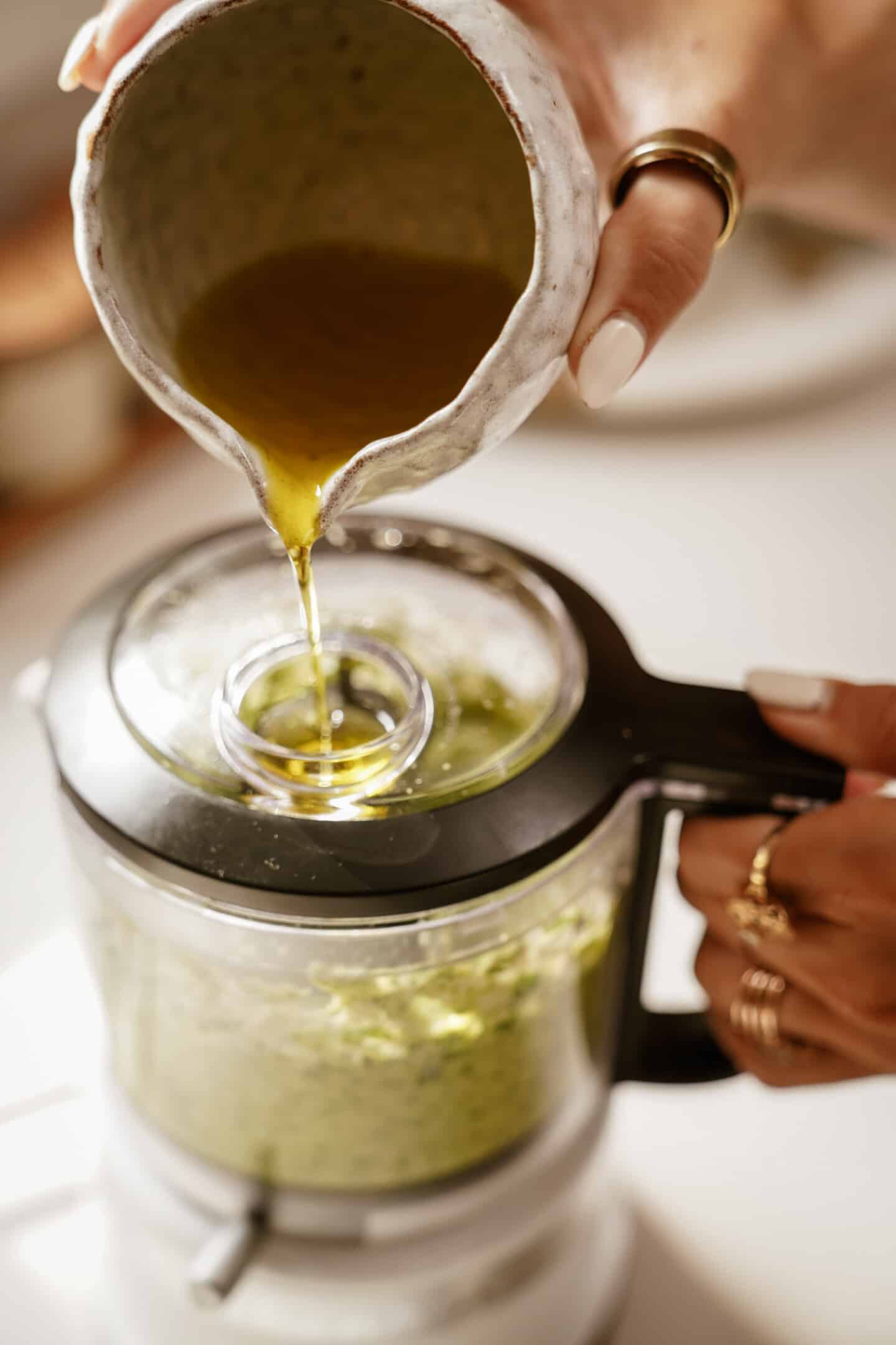 olive oil poured into food processor 