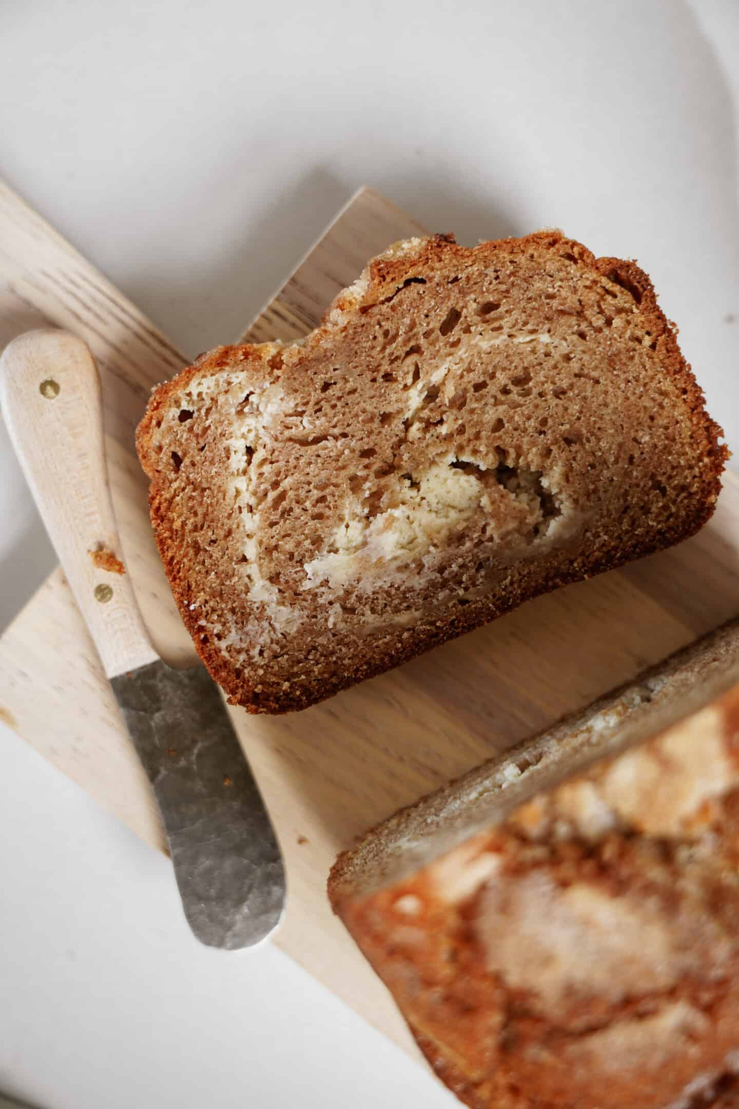 Cinnamon bread cut open on cutting board