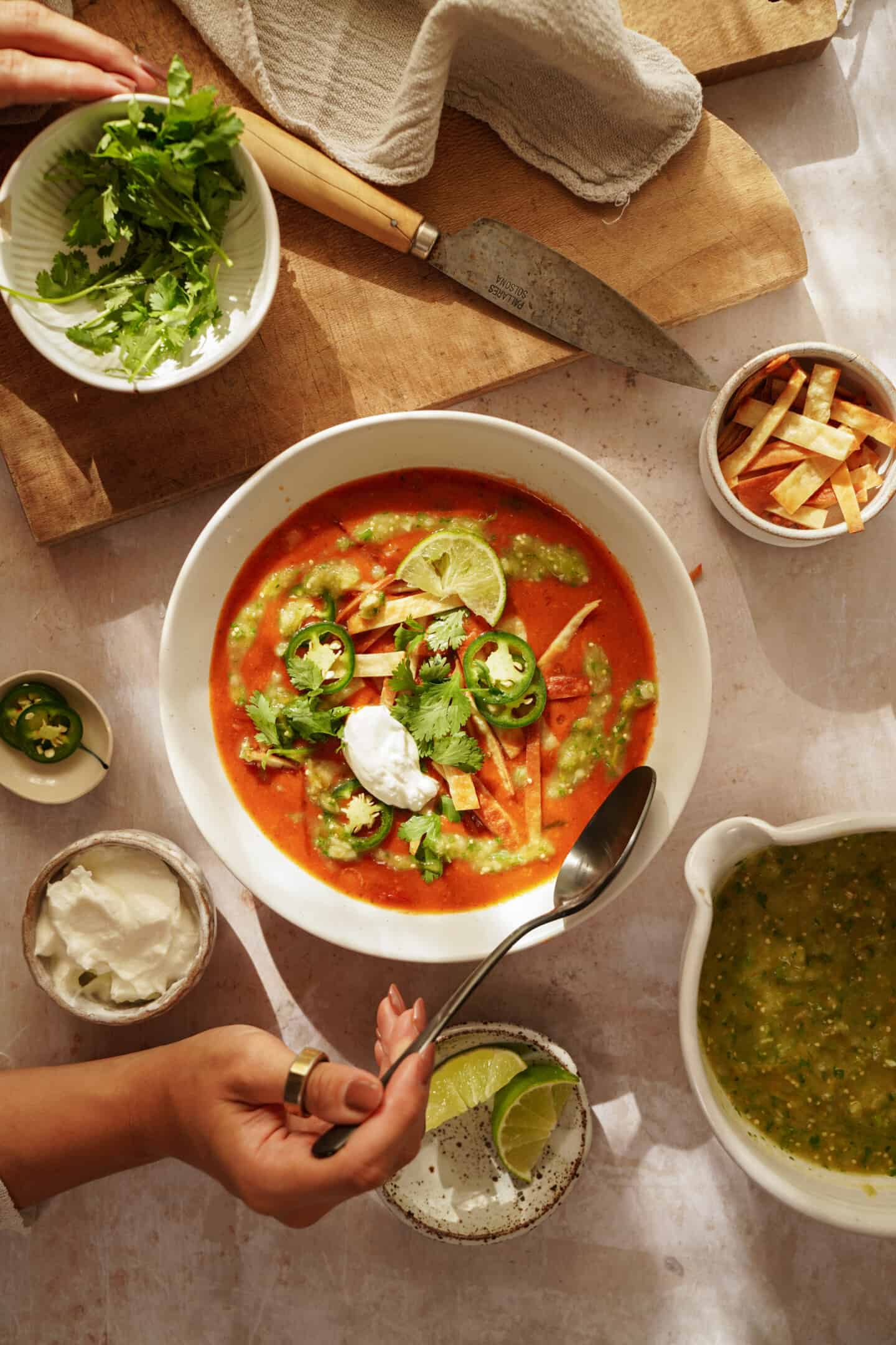 Tortilla soup in a bowl on counter