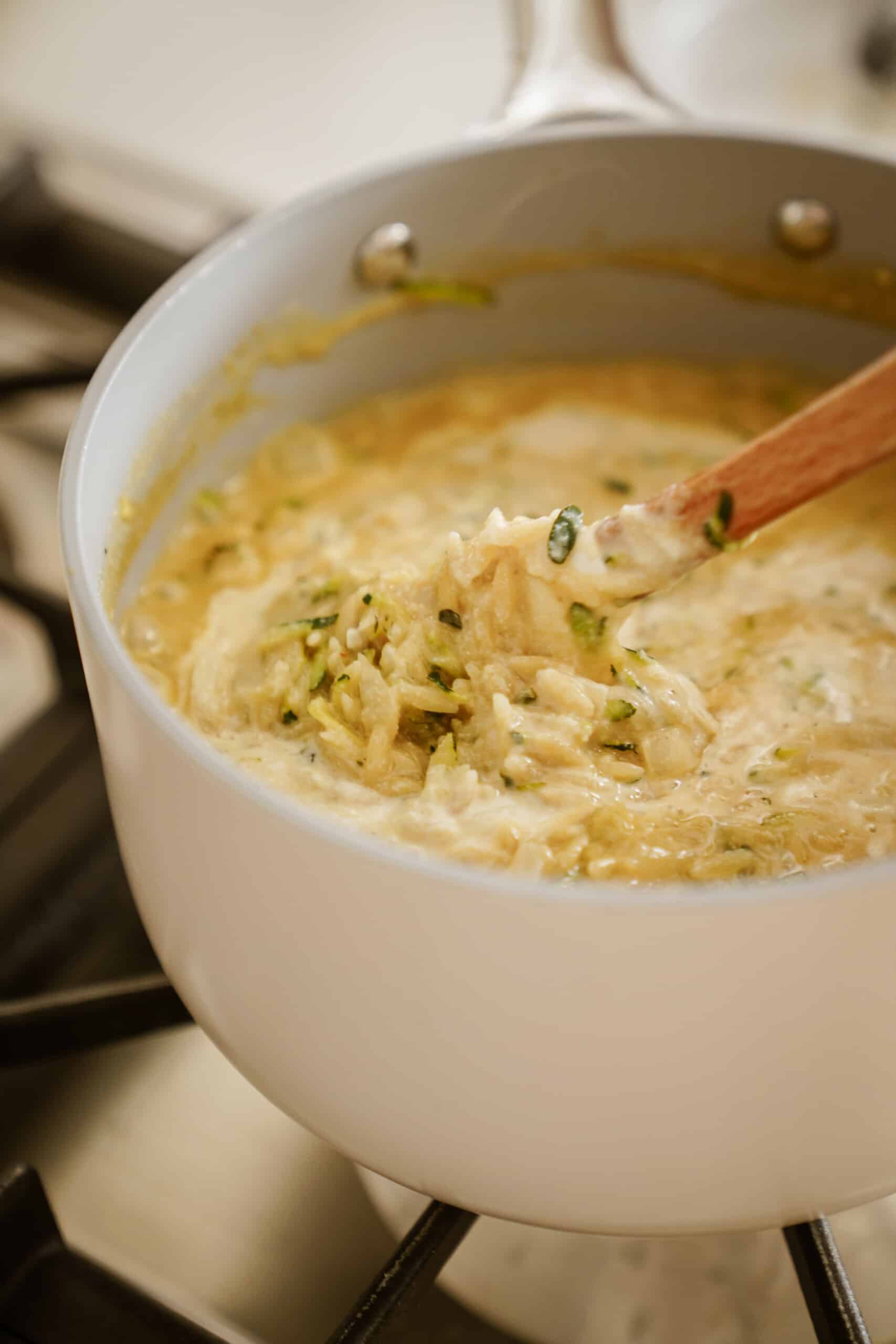 Vegan orzo in pot on stove