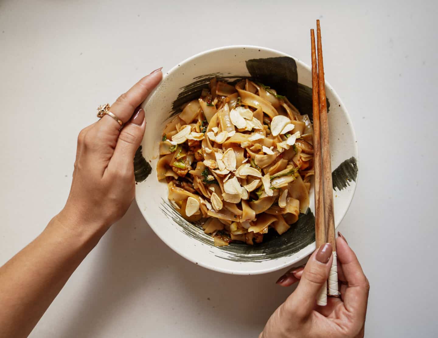 Bowl of vegetable stir fry recipe with chopsticks