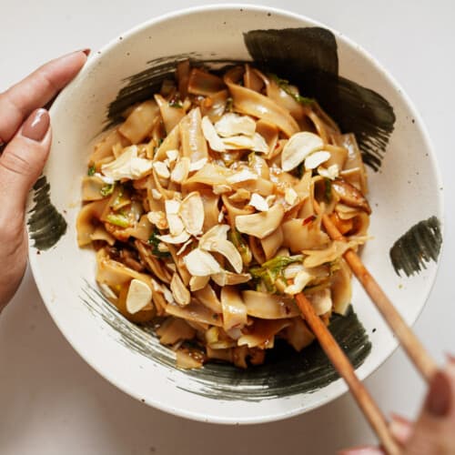 Vegetable stir fry recipe in a bowl with chopsticks