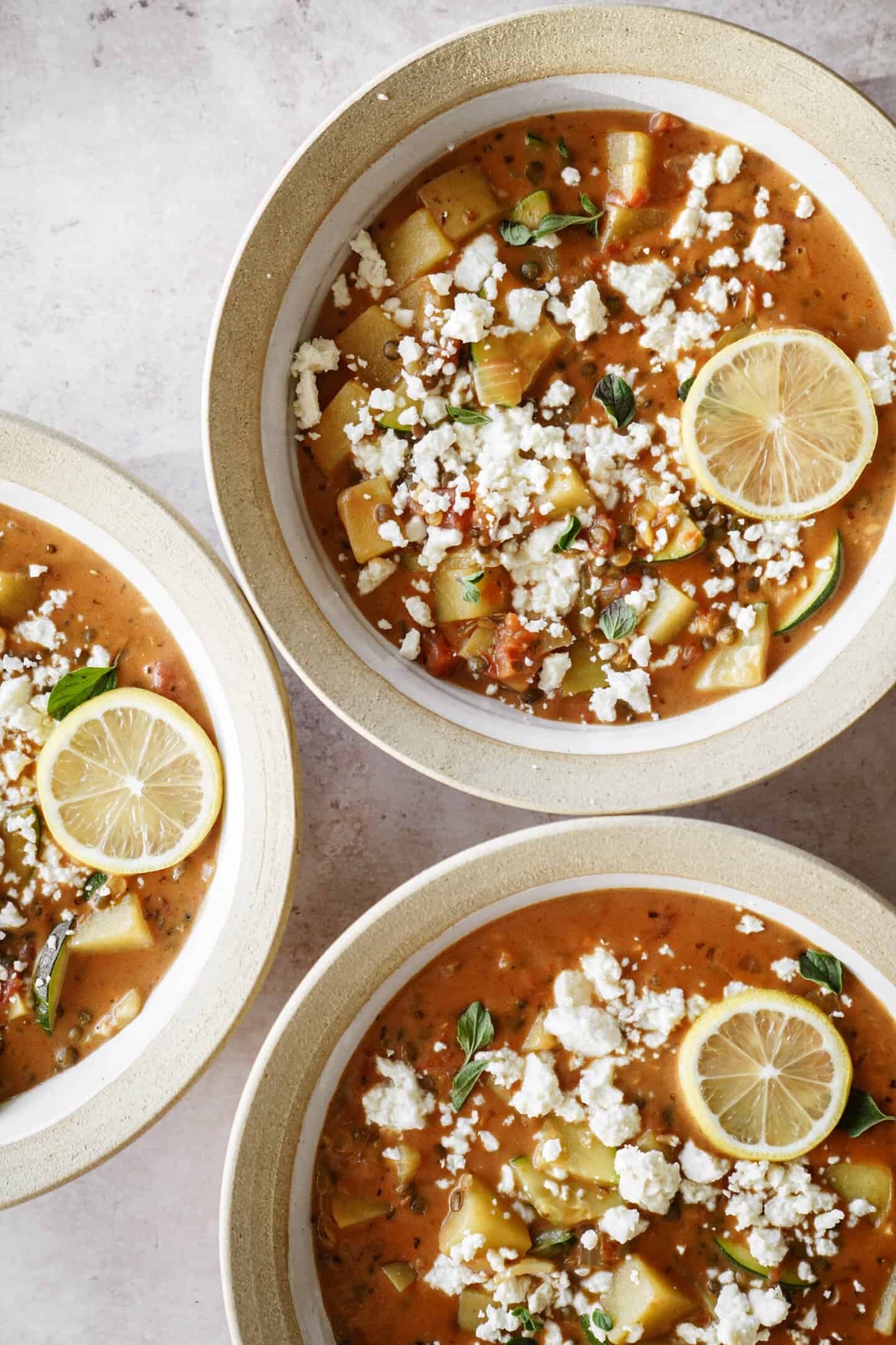 Three bowls of creamy potato soup