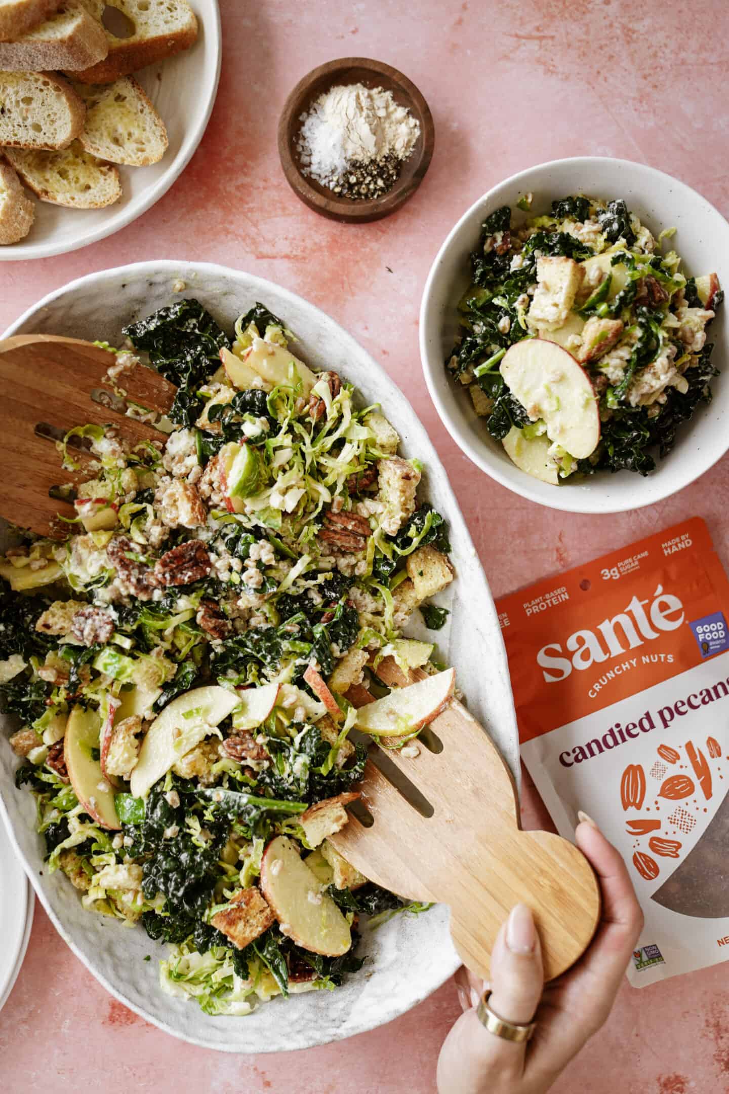 Winter salad in a big serving bowl with Sante nuts on the side