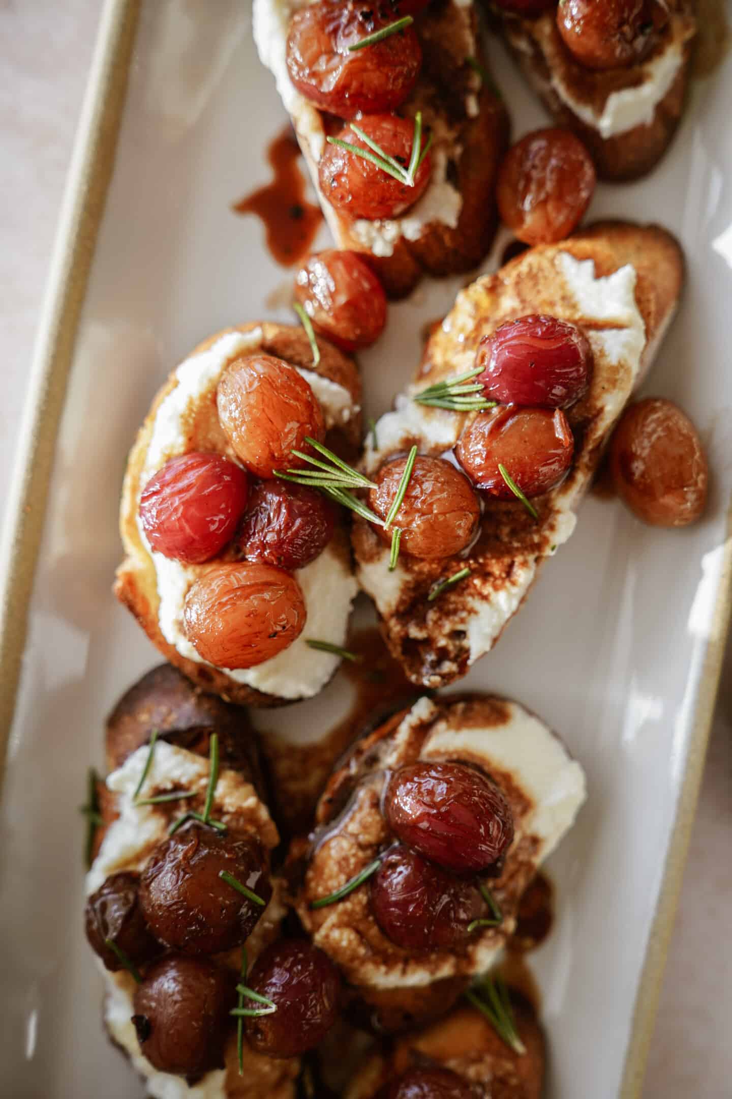 Grape crostini on a serving plate