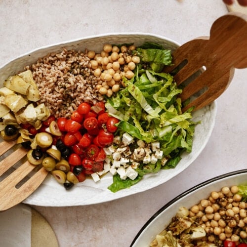 Grain bowl with serving spoons in it