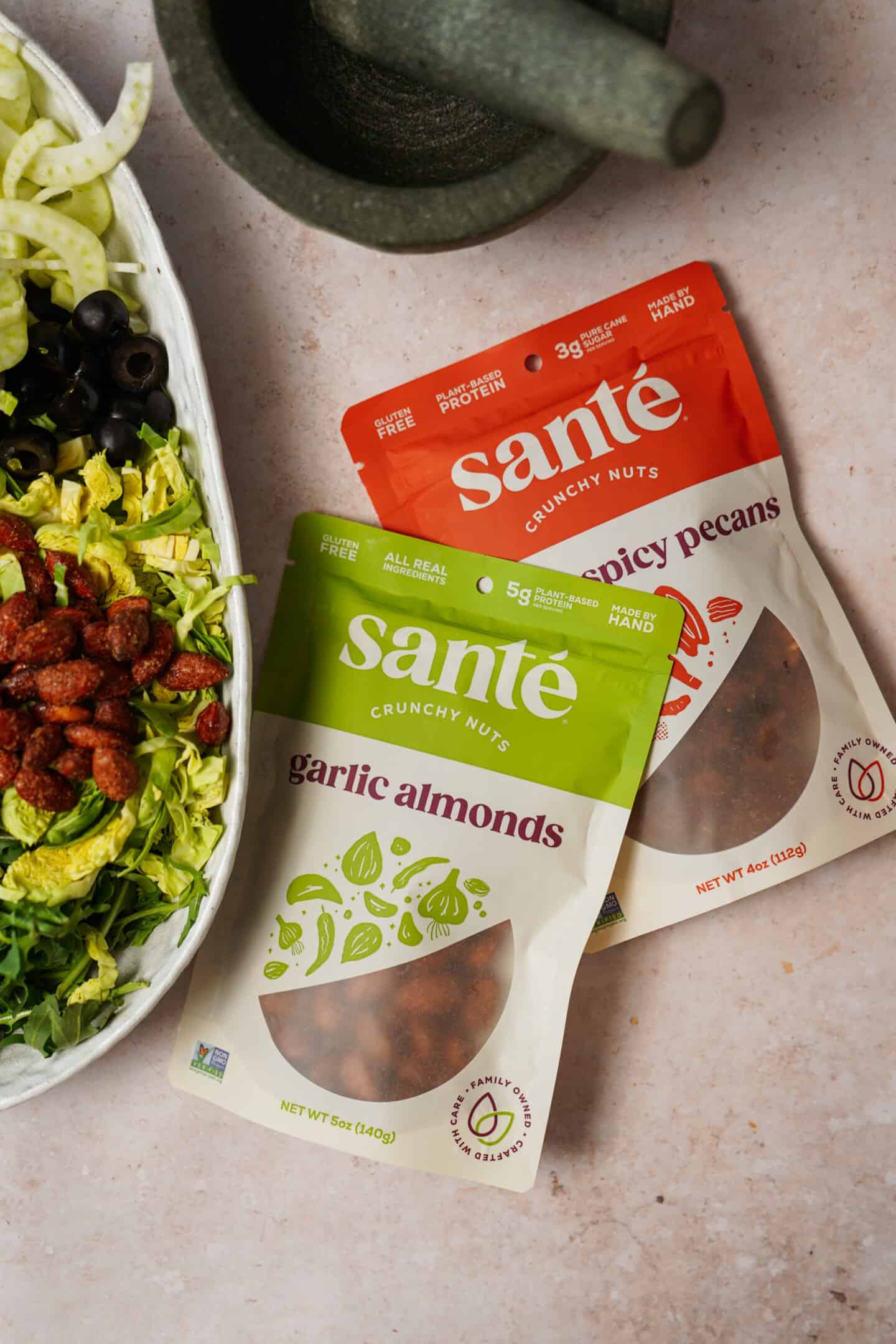 Sante Nuts beside green salad