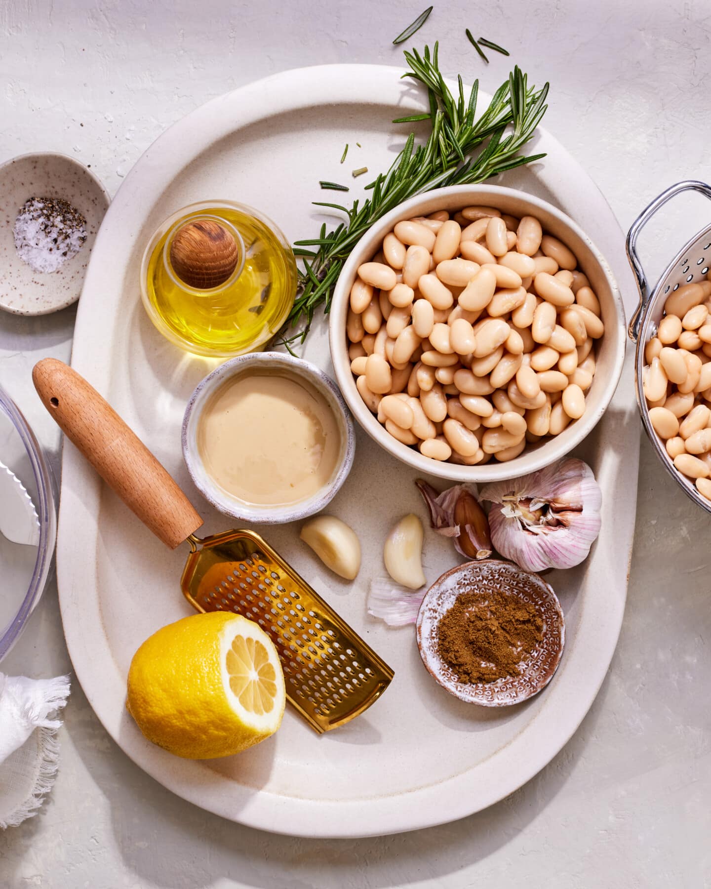 Ingredients for vegan creamy white bean dip on platter