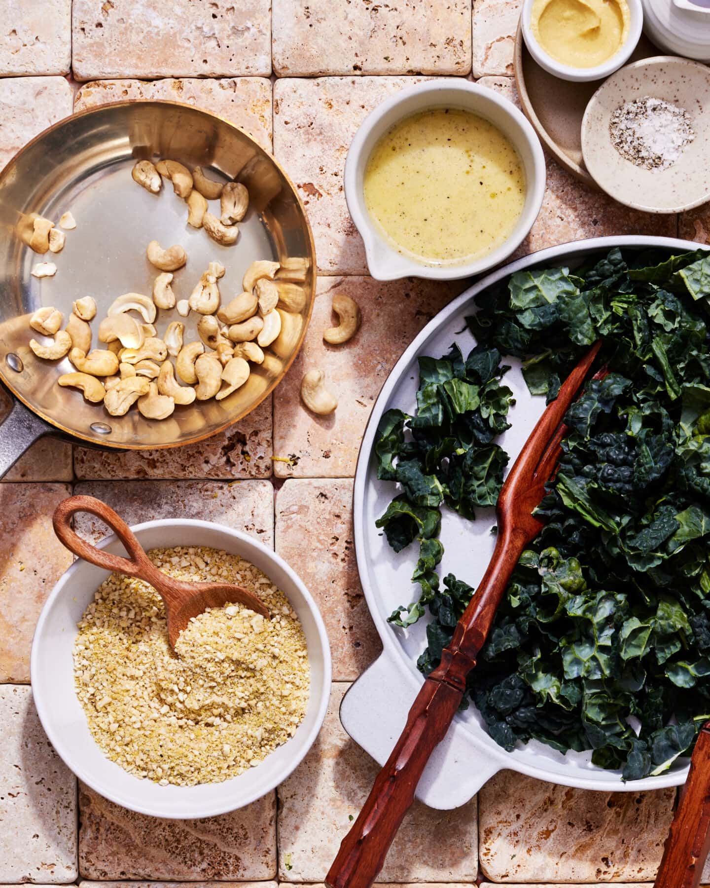 Kale salad recipe on counter with ingredients