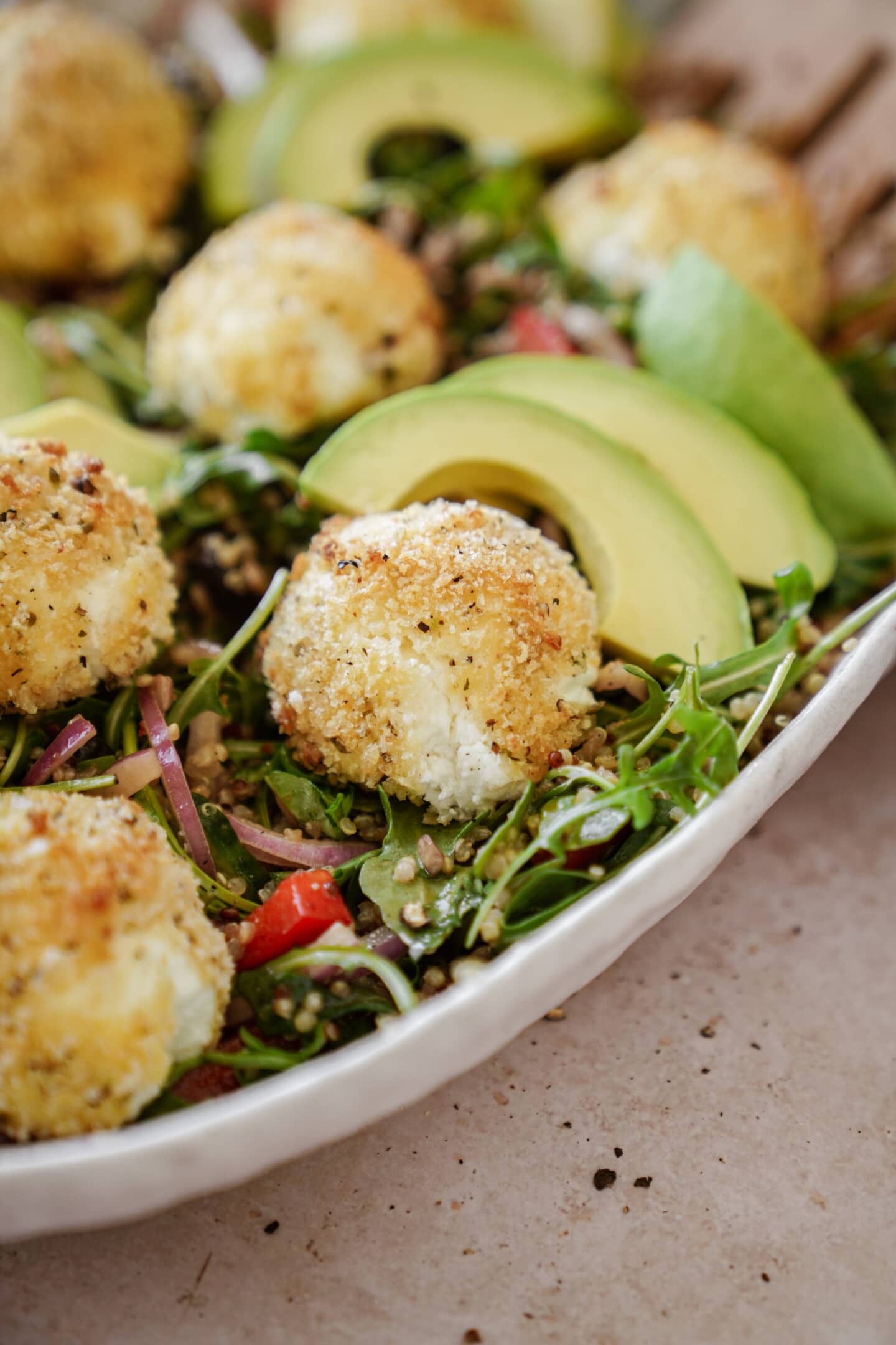 Goat cheese balls in a serving dish