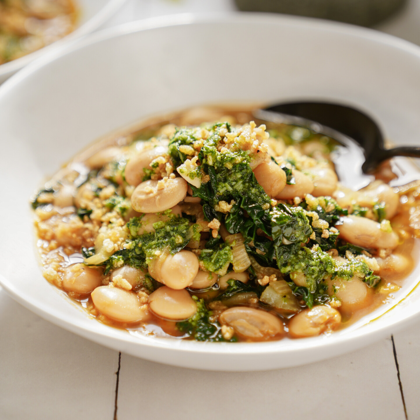 Bean stew in a white bowl