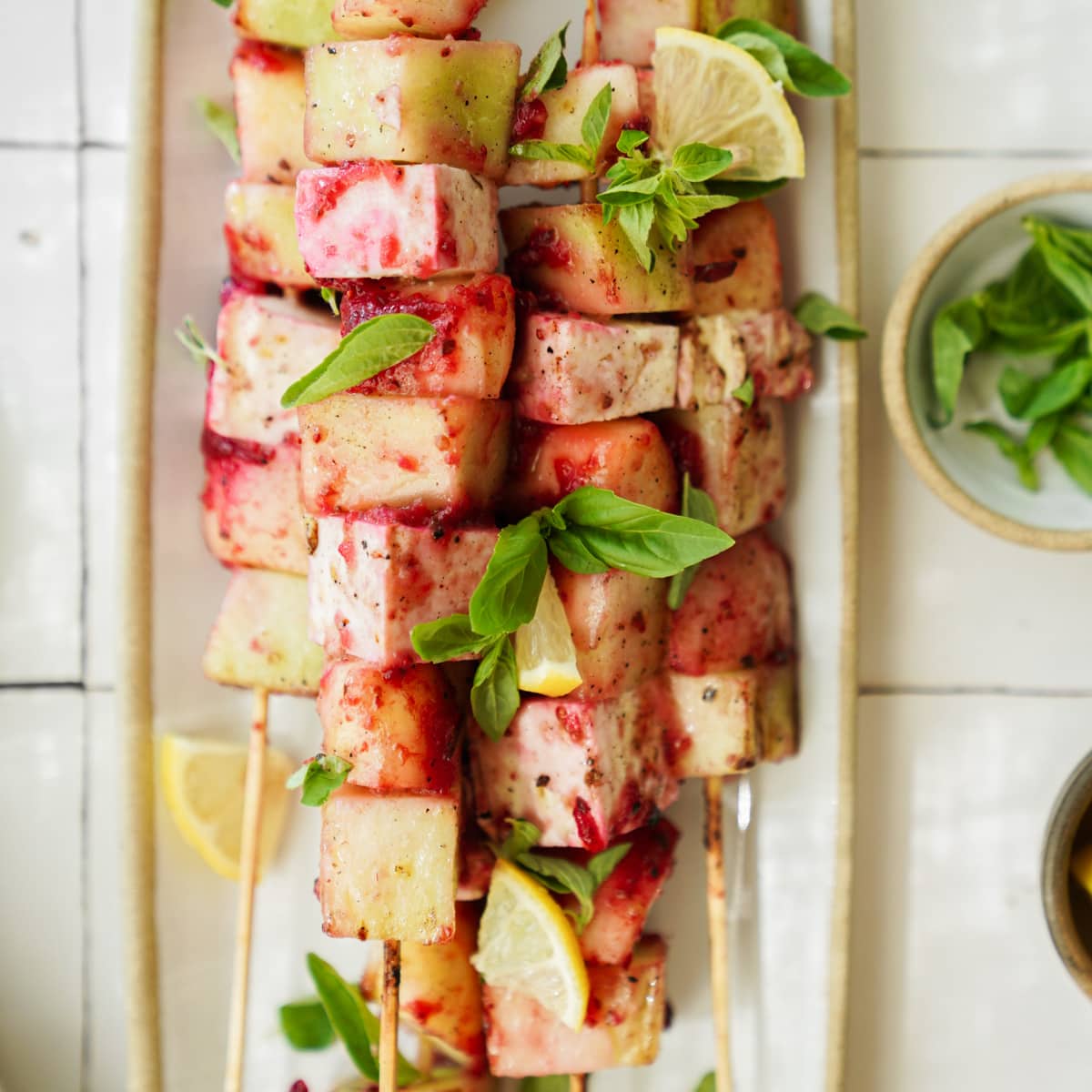 Fruit kabobs on the grill on a serving dish 