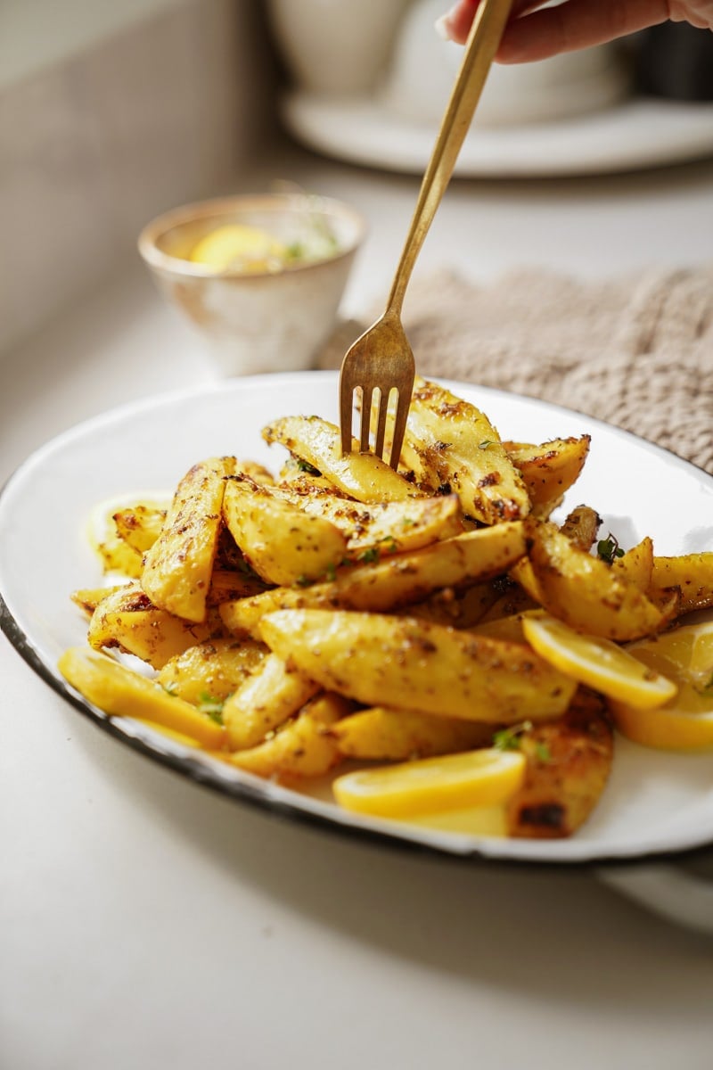 Greek potatoes with a fork in it