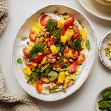 Whipped feta recipe in a white serving dish on a table