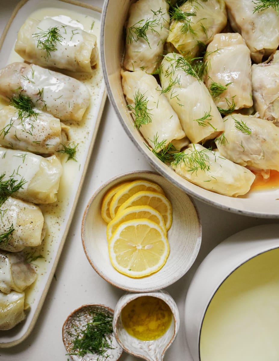 Stuffed Cabbage Rolls Recipe surrounded by ingredients on counter
