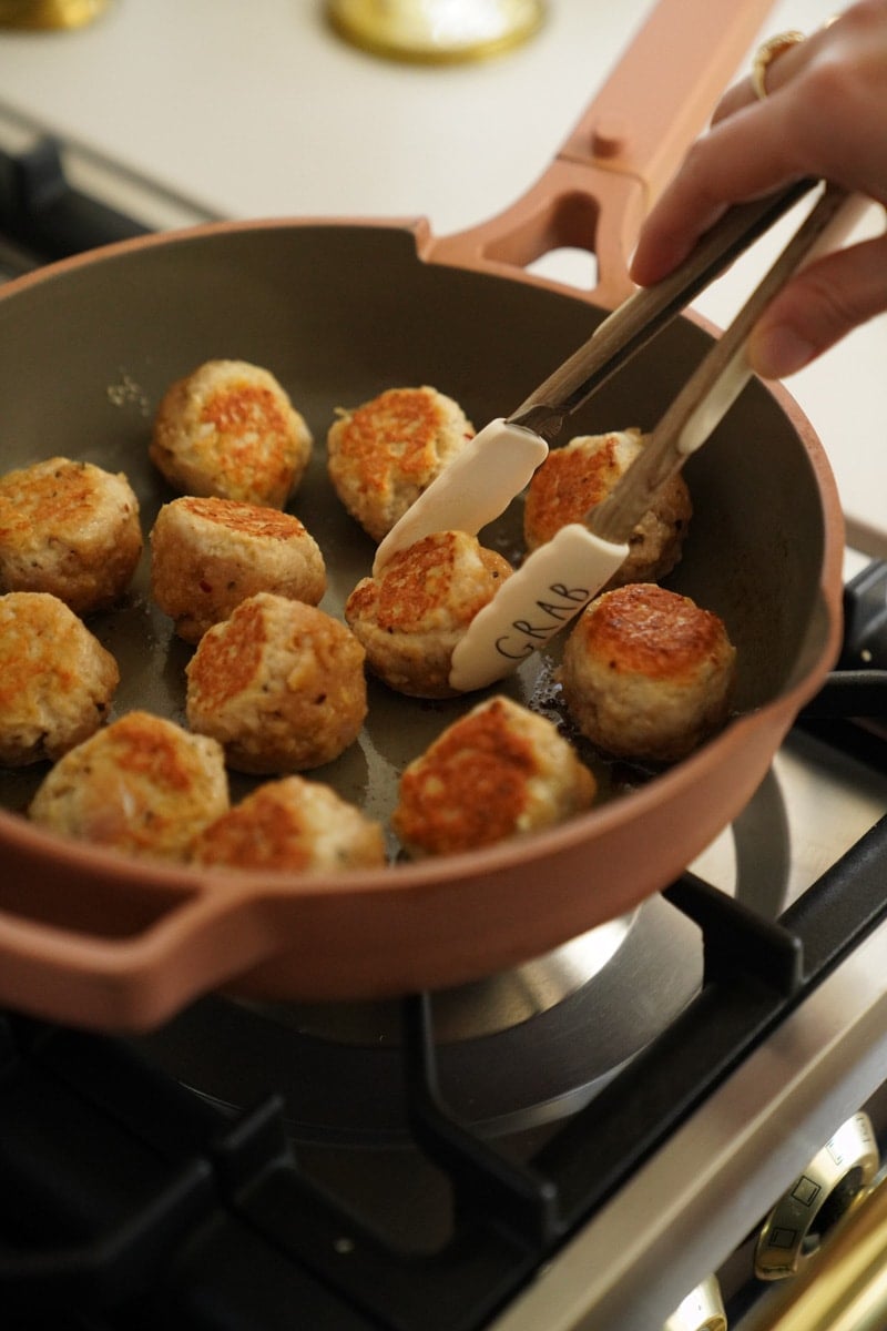 firecrackers meatballs in a pan cooking