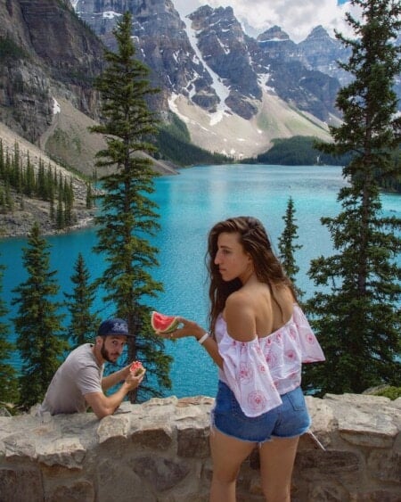 Maria and Andrew eating watermelon