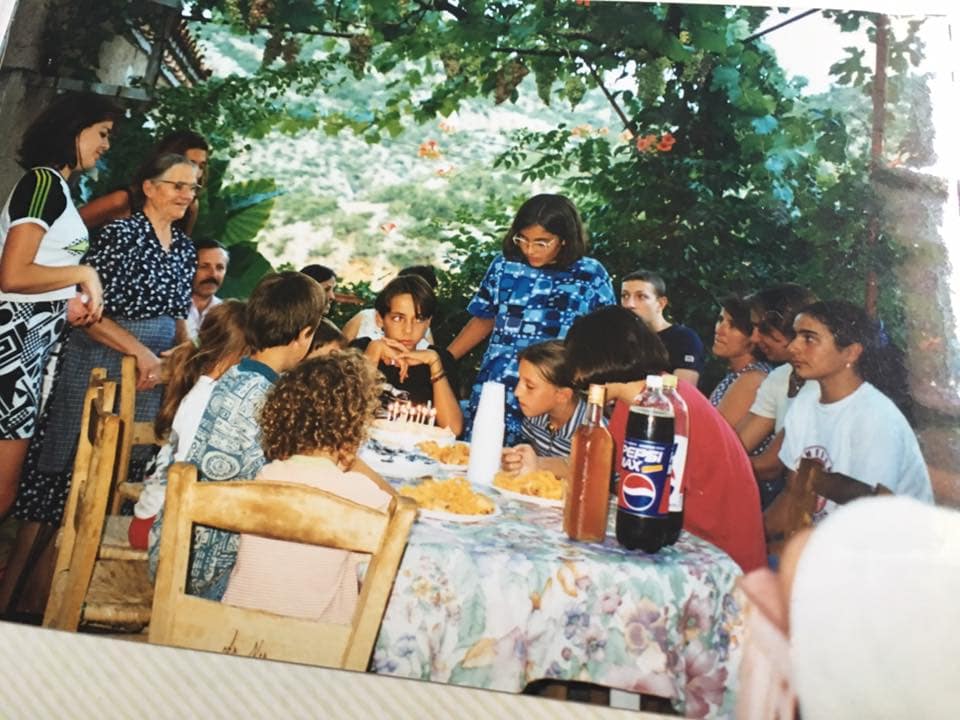 Maria and her family gathered around a table