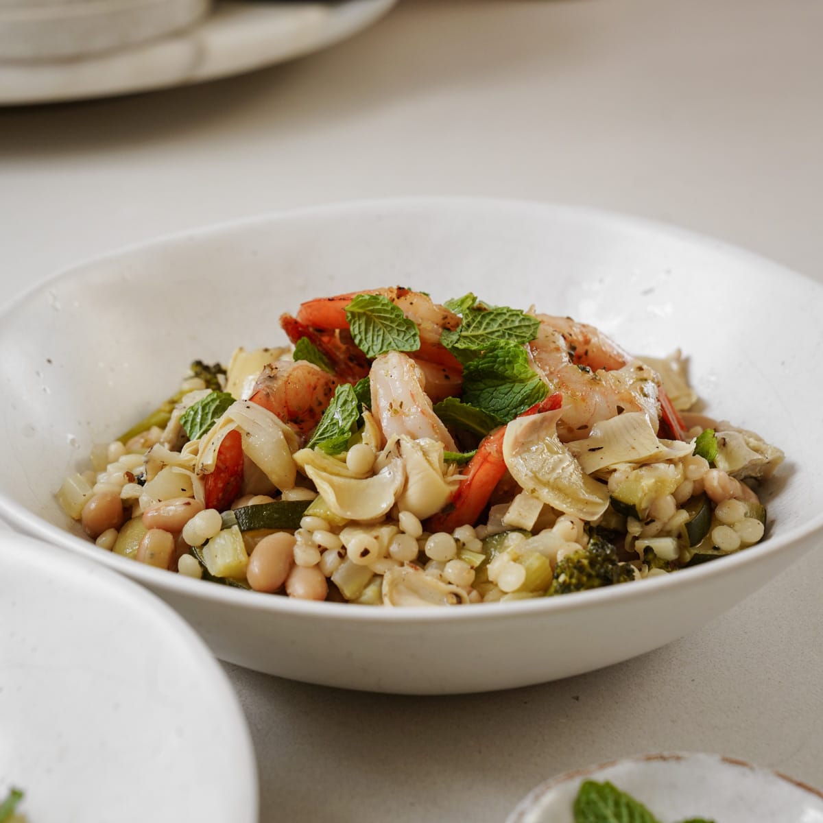 Pearl couscous in a white bowl