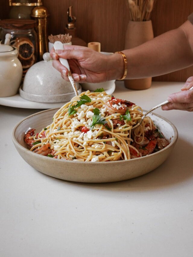 Shrimp Linguine being scooped out of a bowl
