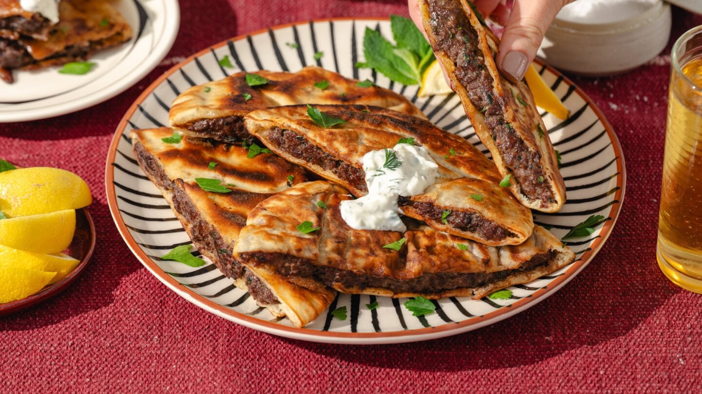 A plate of food with meat and sauce.